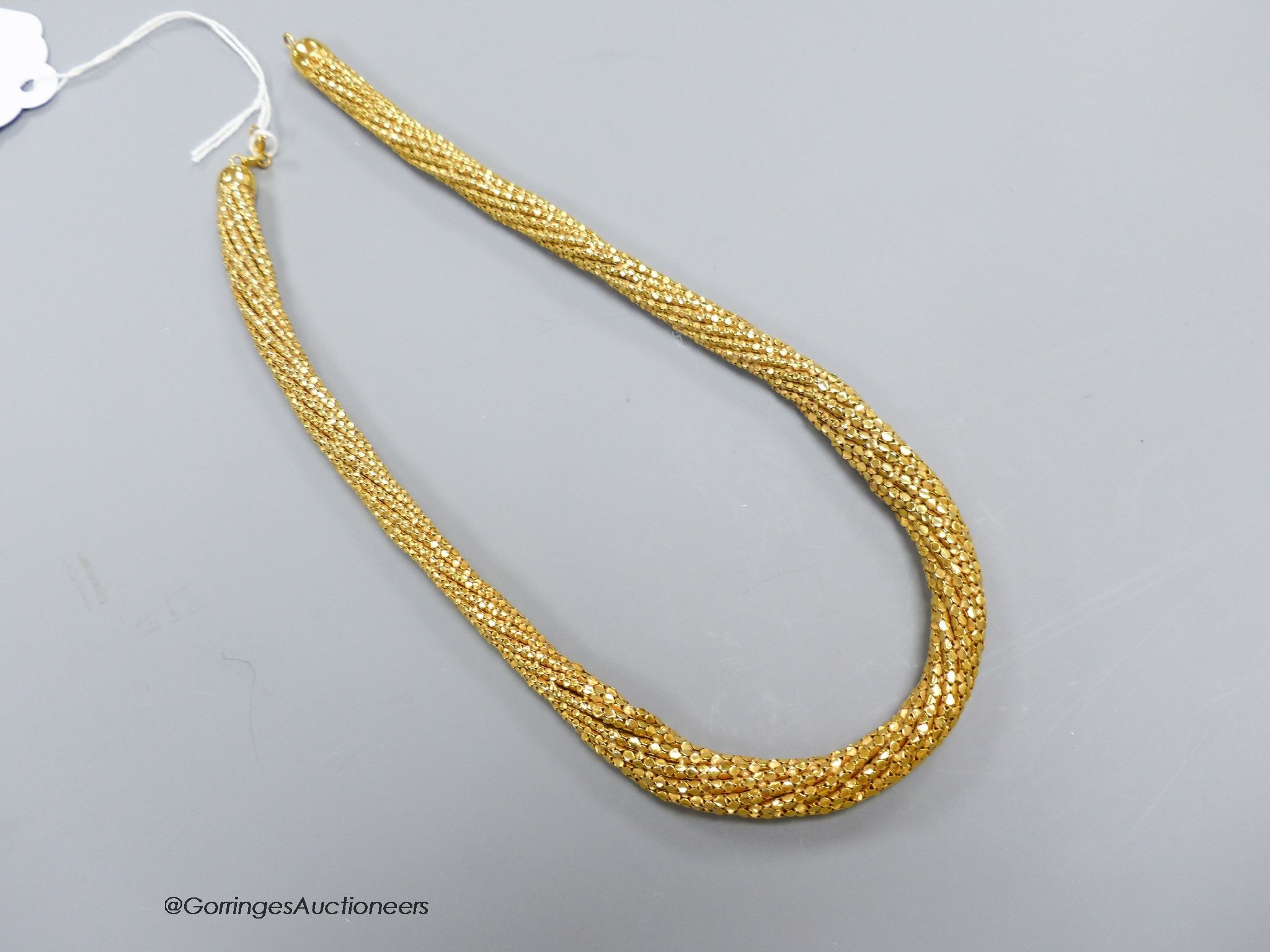 A yellow gold (9kt), flexible close link necklace of tapering form, gross 50g, 43cm.